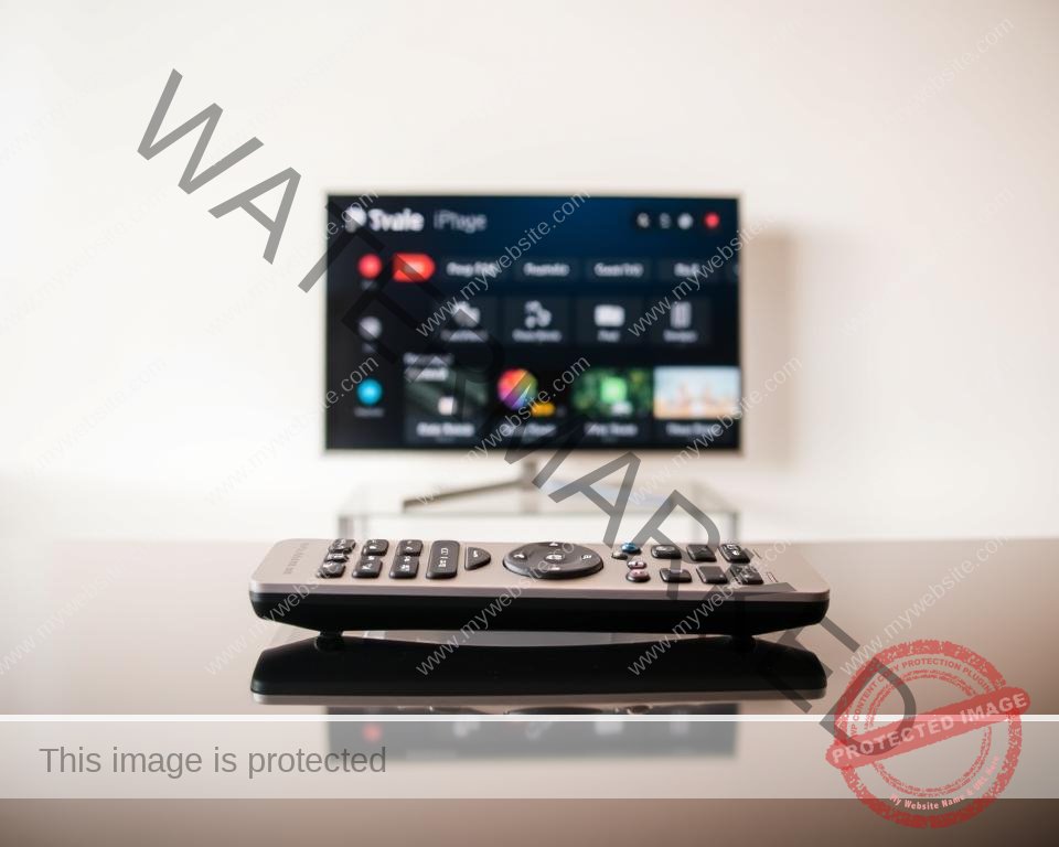 A modern, minimalist IPTV subscription dashboard against a clean, white backdrop. In the foreground, a sleek, silver remote control rests on a glossy, black surface, subtly hinting at the high-tech nature of the service. The middle ground features a tablet or smartphone displaying a simple, user-friendly interface with various IPTV package options, emphasizing affordability and accessibility. The background gently blurs out, keeping the focus on the core offering. Soft, natural lighting casts a warm, inviting glow, conveying a sense of reliability and professionalism. The overall composition suggests a streamlined, hassle-free IPTV experience tailored to the UK market.